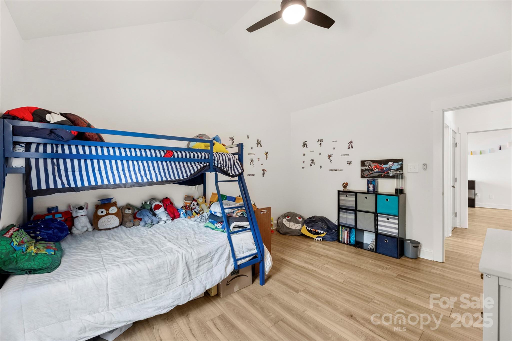 7683 Sarah Drive Denver, NC 28037 - Photo 5 of 25 a bed room with furniture and a wooden floor