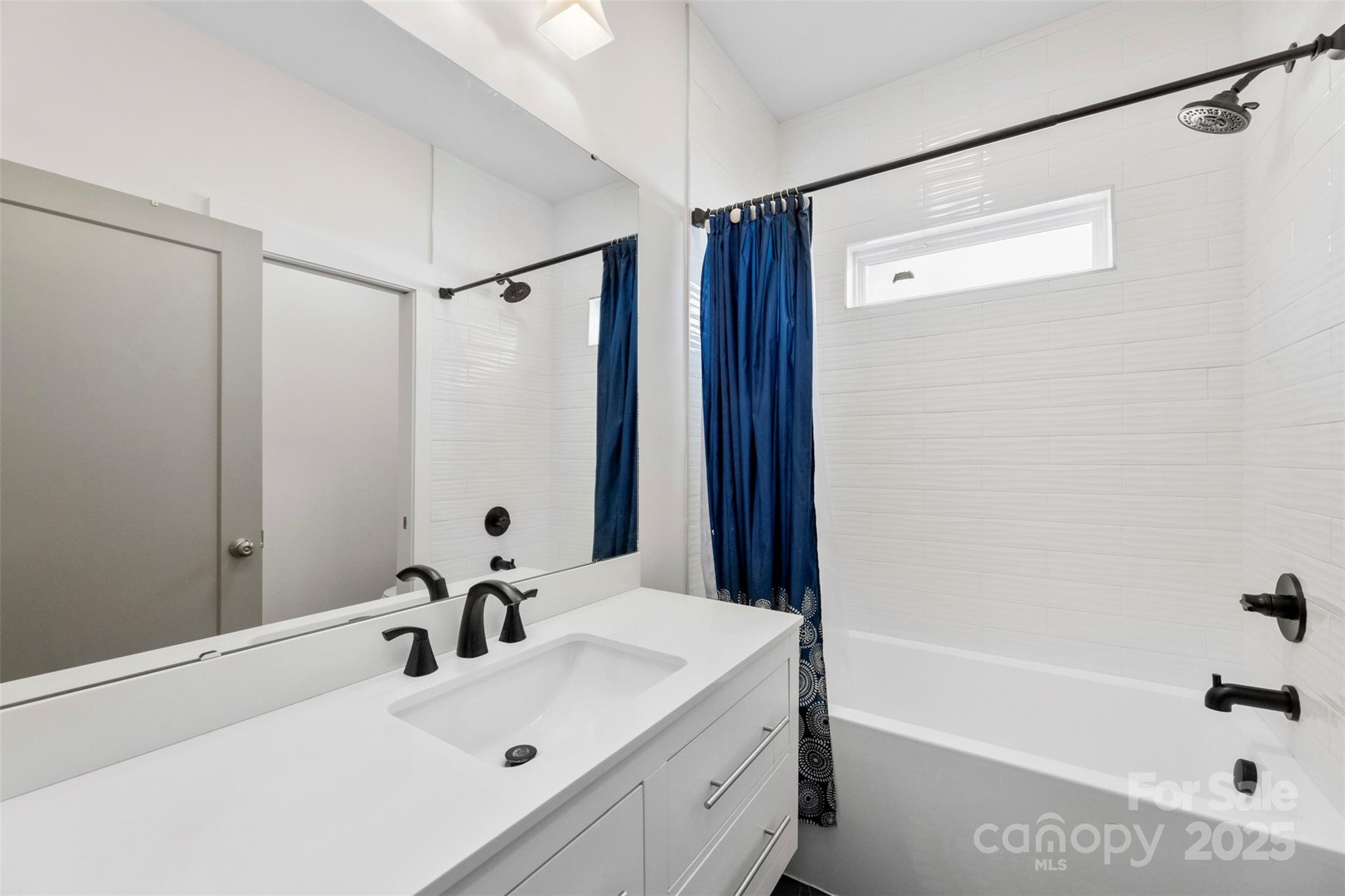 7683 Sarah Drive Denver, NC 28037 - Photo 6 of 25 a bathroom with a sink and a tub