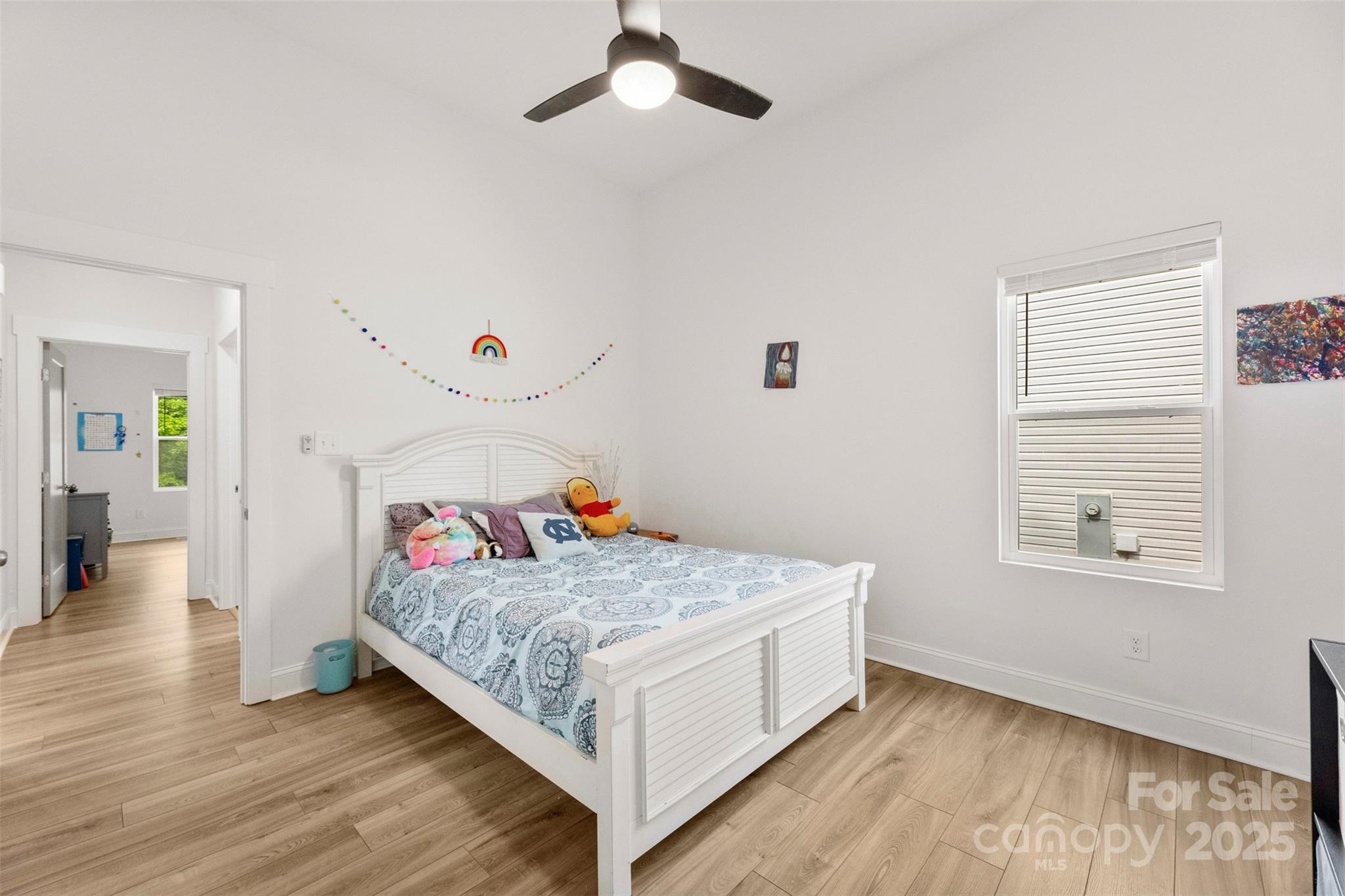 7683 Sarah Drive Denver, NC 28037 - Photo 8 of 25 a bedroom with a bed and window