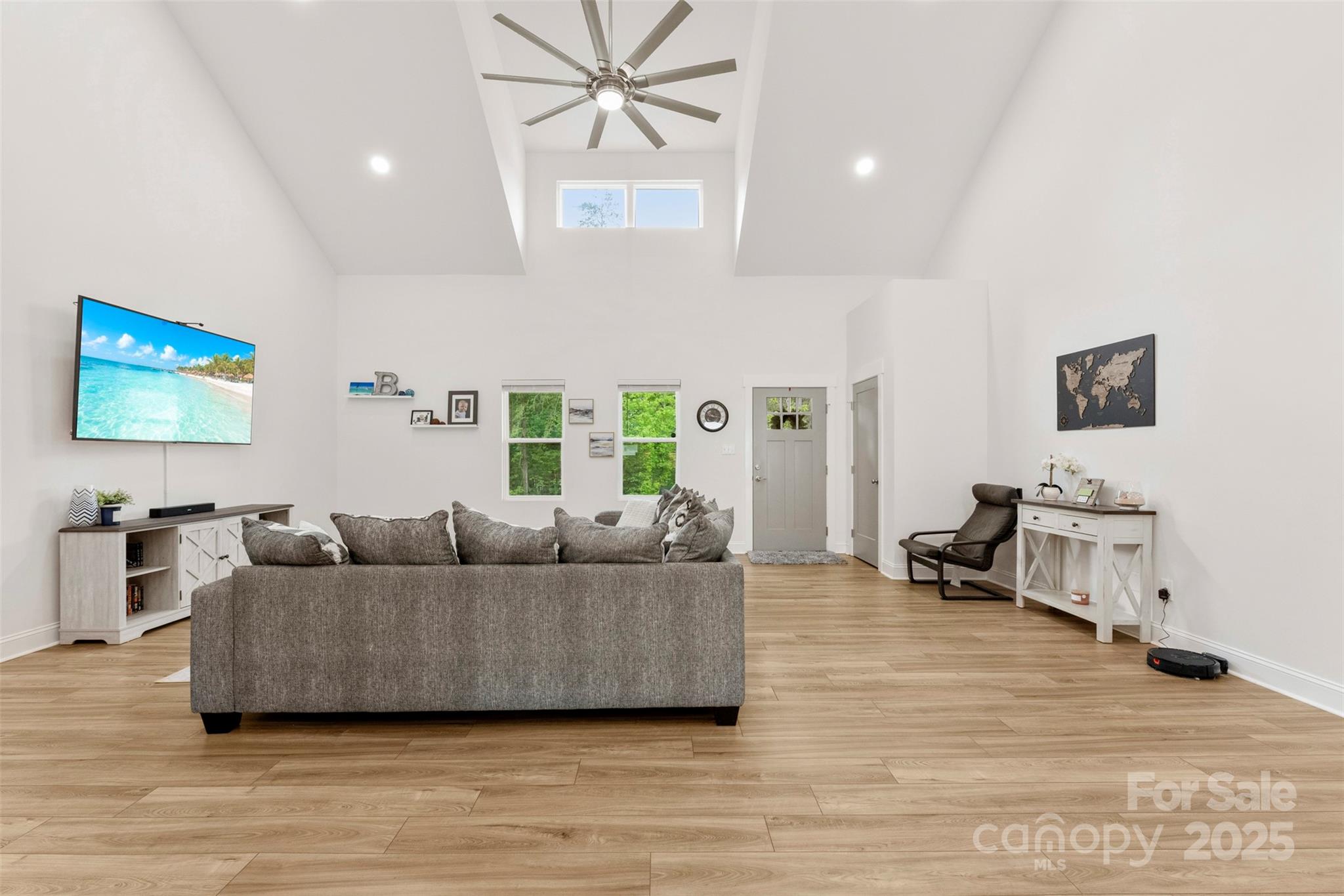 7683 Sarah Drive Denver, NC 28037 - Photo 9 of 25 a living room with furniture and a flat screen tv
