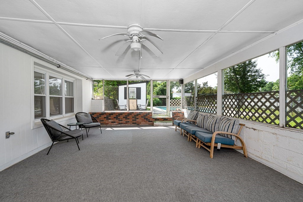 174 Frost Road Tyngsborough, MA 01879 - Photo 11 of 17 a living room with furniture and a ceiling fan