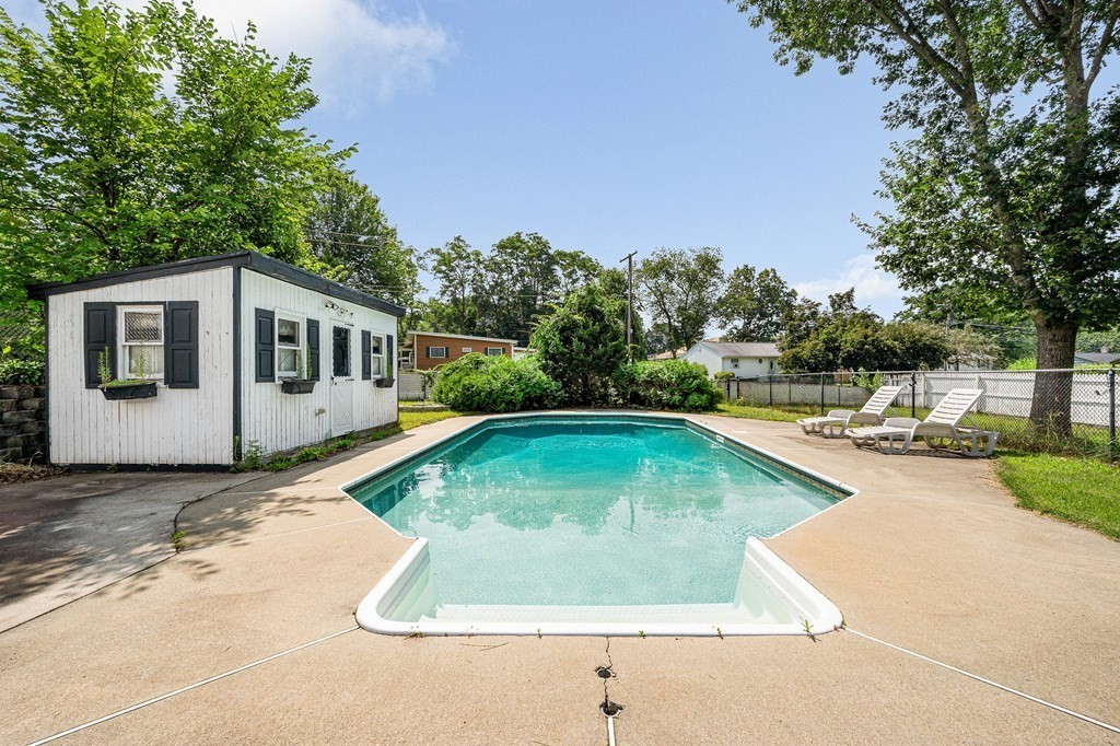 174 Frost Road Tyngsborough, MA 01879 - Photo 13 of 17 a view of a house with swimming pool