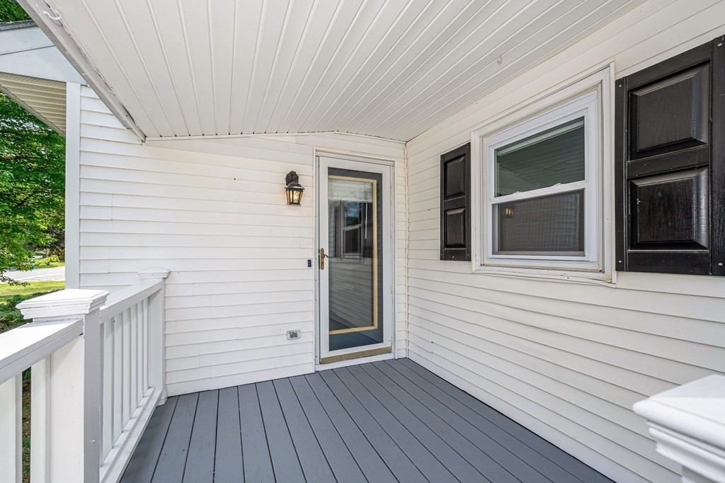 174 Frost Road Tyngsborough, MA 01879 - Photo 16 of 17 a view of a house with wooden deck