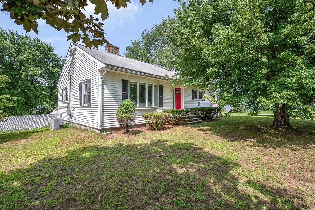 174 Frost Road Tyngsborough, MA 01879 - Photo 17 of 17 a view of a house with backyard and sitting area