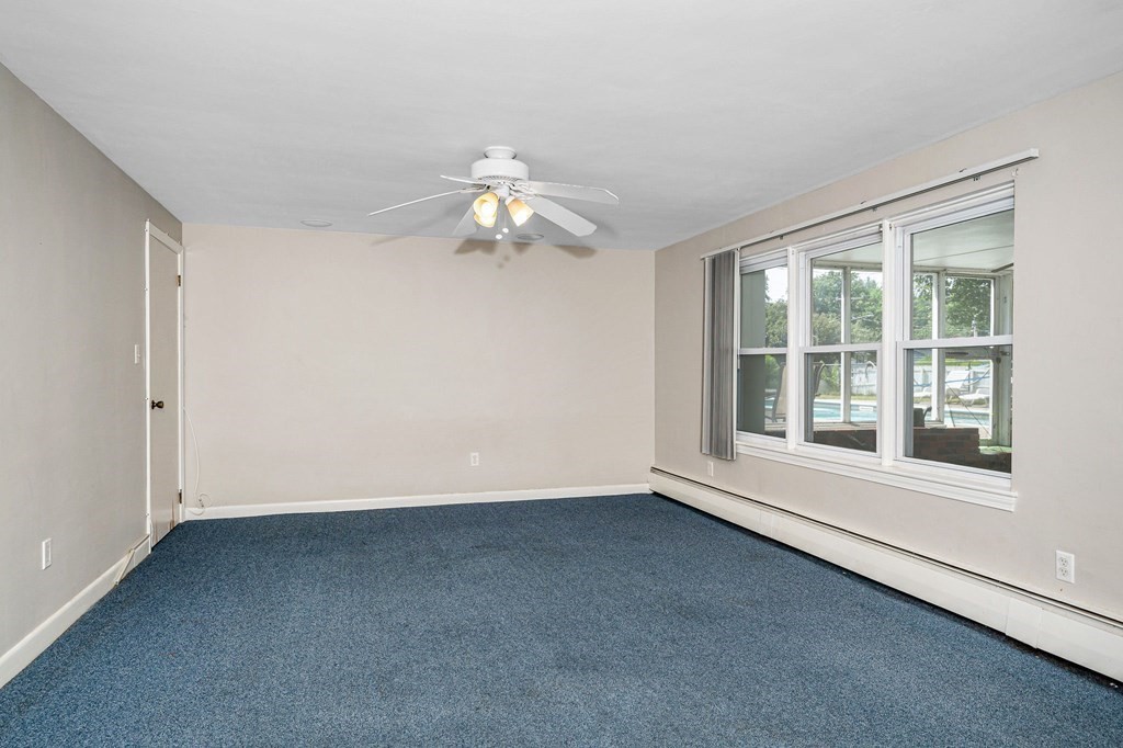 174 Frost Road Tyngsborough, MA 01879 - Photo 10 of 17 an empty room with a window