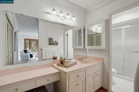 a bathroom with a sink double vanity and a mirror