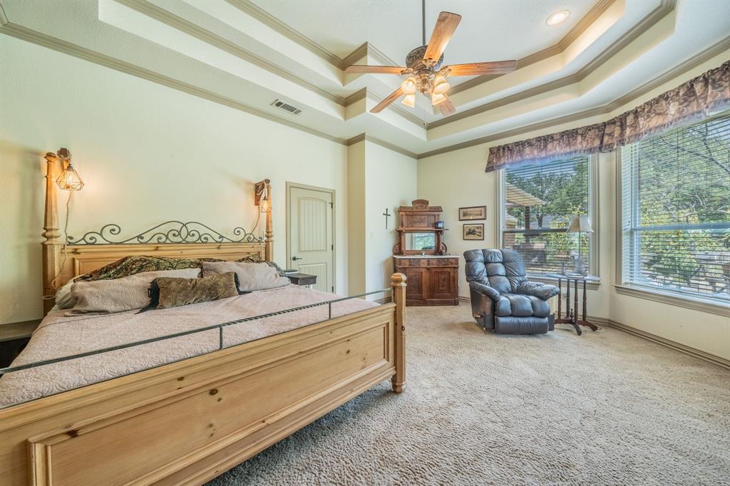 109 Overton Ridge Circle Weatherford, TX 76088 - Photo 11 of 27 Large primary bedroom suite.