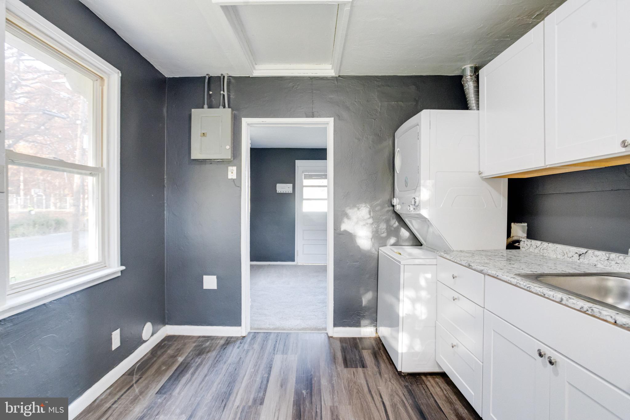 2 Chesapeake Court Aberdeen, MD 21001 - Photo 13 of 35 a spacious bathroom with a granite countertop sink and a mirror