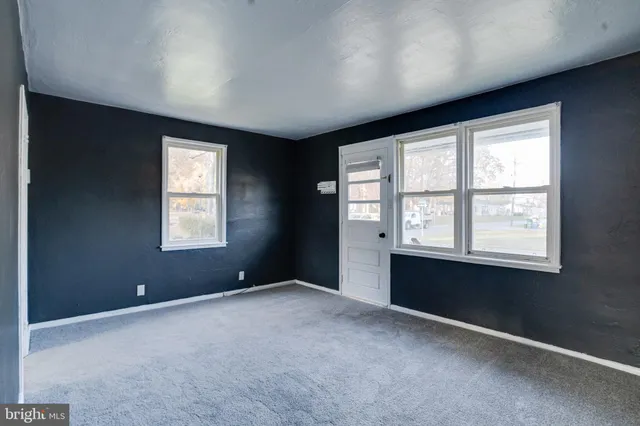 an empty room with windows