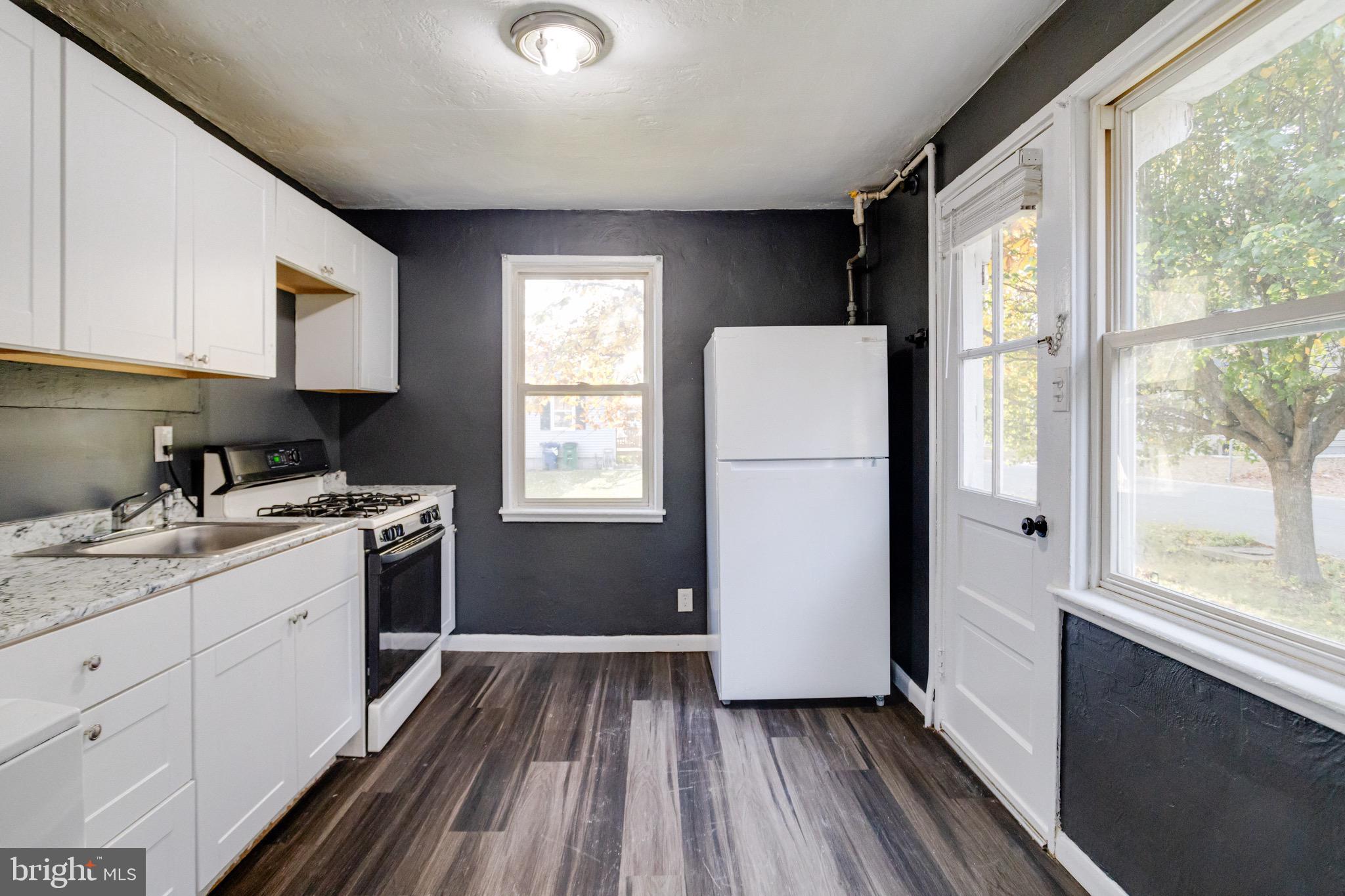 2 Chesapeake Court Aberdeen, MD 21001 - Photo 9 of 35 a kitchen with a refrigerator and a sink