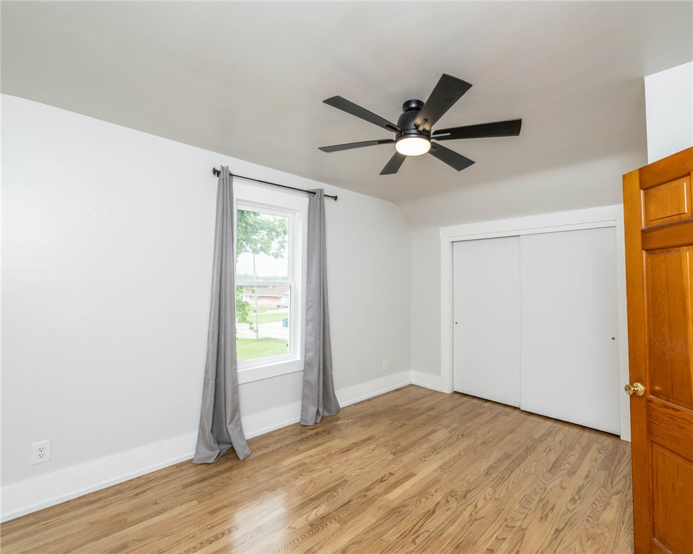 190 Swailes Road Troy, OH 45373 - Photo 44 of 82 This cozy bedroom features durable hardwood flooring and a ceiling fan, offering comfortable living.
