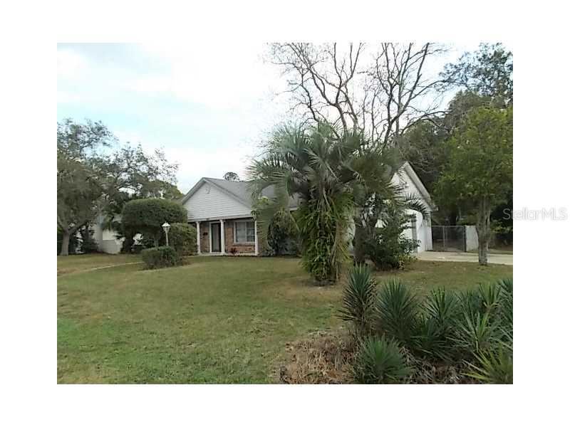 a view of a big yard with a house