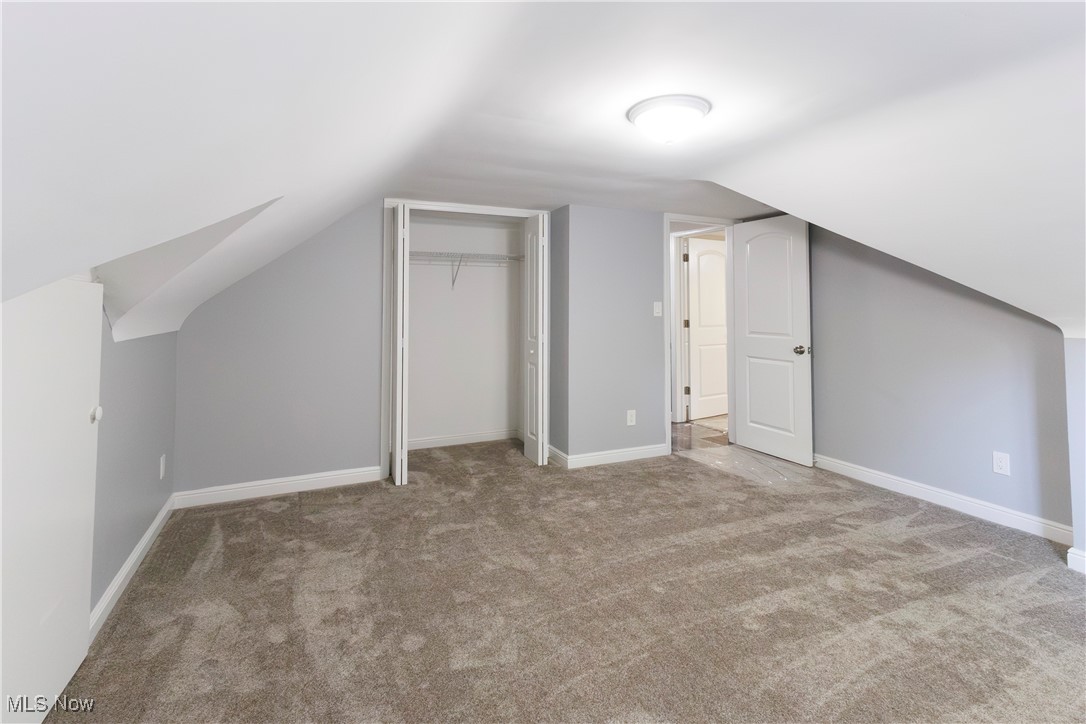 36625 Jackson Road Chagrin Falls, OH 44022 - Photo 27 of 50 Additional living space featuring vaulted ceiling and light colored carpet