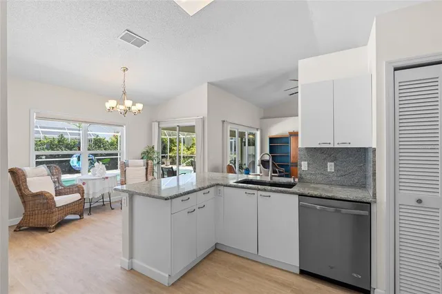a house view with a seating space and a large garden