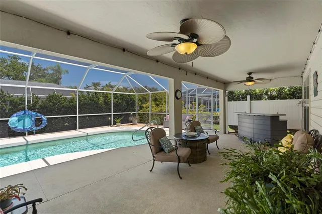 a view of a patio with couches chairs and potted plants