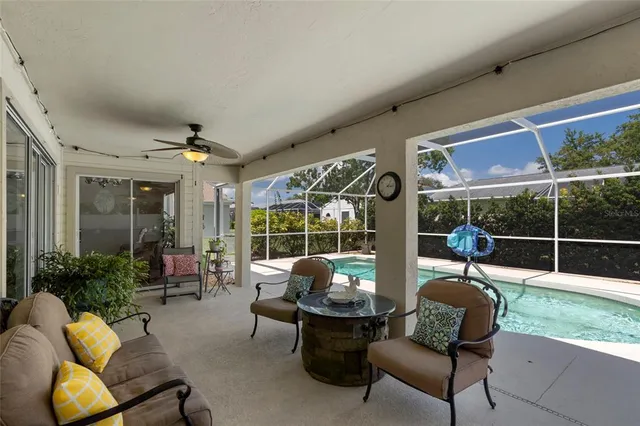 a view of a house with backyard porch and sitting area