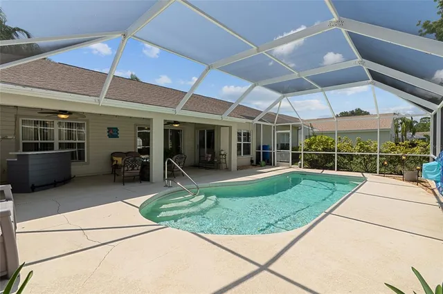 a view of a house with sitting area and a yard