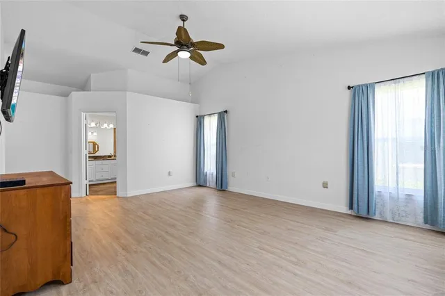 a bathroom with a granite countertop double vanity sink and a mirror
