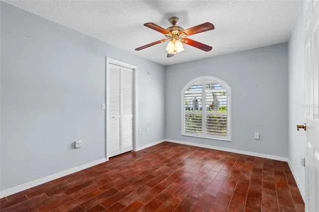 a view of livingroom with hardwood floor and a ceiling fan