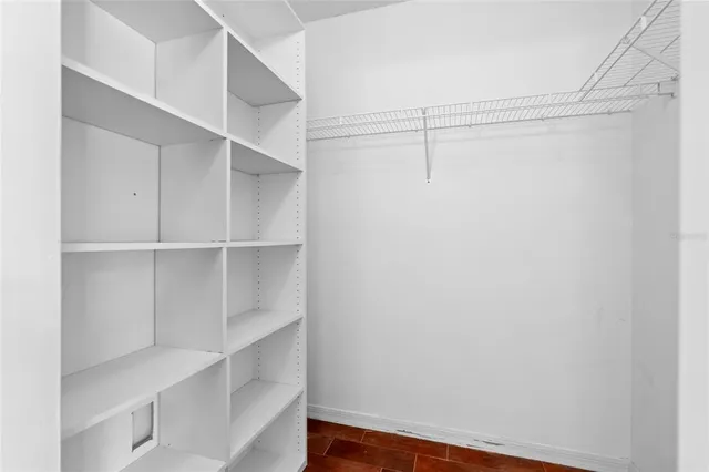 a bedroom with two beds and a window