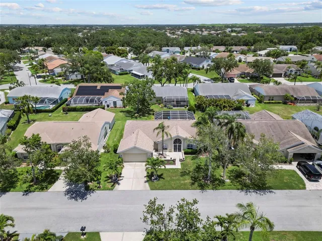an aerial view of residential houses with outdoor space