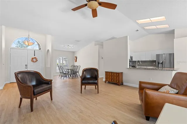 a living room with furniture and a chair