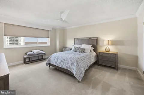 a bed room with a bed and a lamp