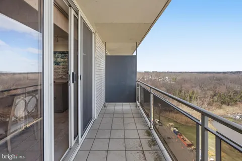 a view of swimming pool with outdoor seating and city view