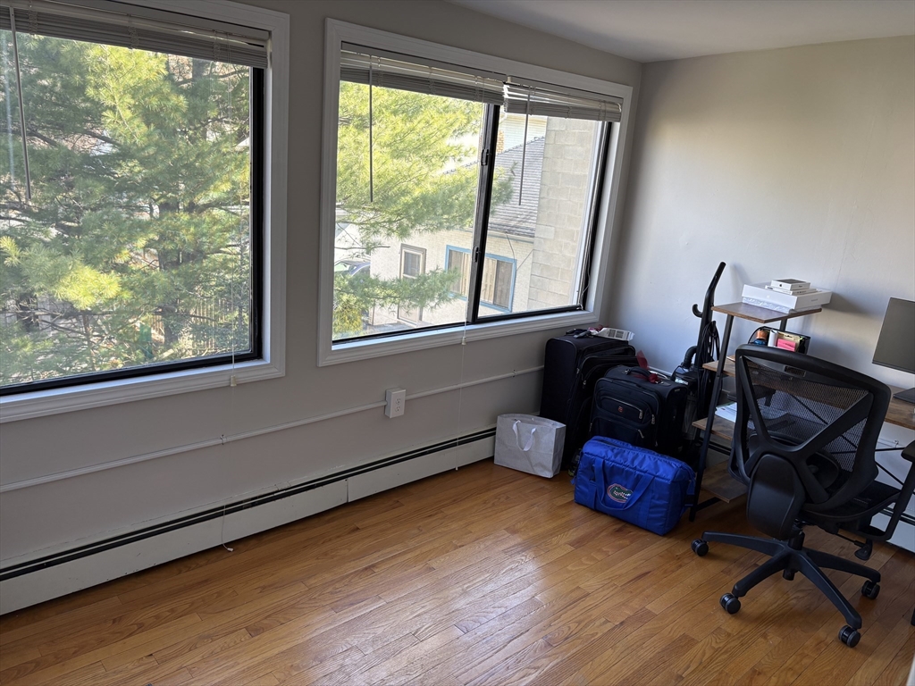 73 Nichols Avenue, Unit 2 Watertown, MA 02472 - Photo 7 of 9 a room with furniture and a window