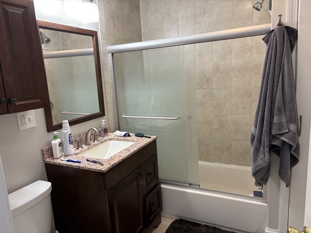 73 Nichols Avenue, Unit 2 Watertown, MA 02472 - Photo 8 of 9 a bathroom with a sink and a mirror