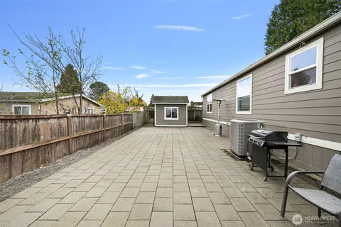 a view of a backyard with sitting area