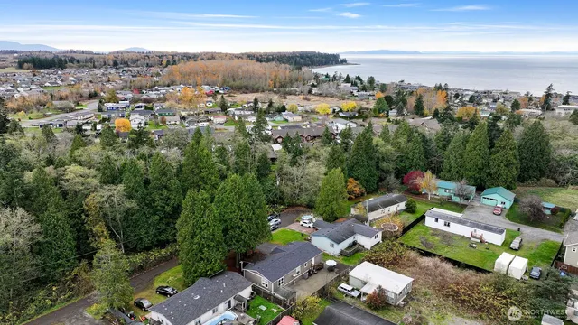 an aerial view of a houses with a yard