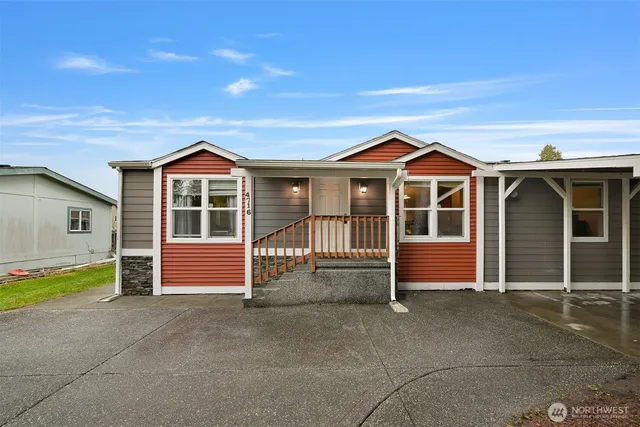 a front view of a house with a porch