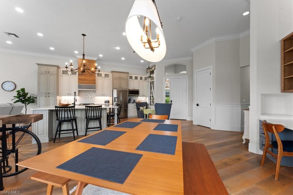 8541 Peppertree Way Naples, FL 34114 - Photo 11 of 41 a lobby with furniture and a dining table