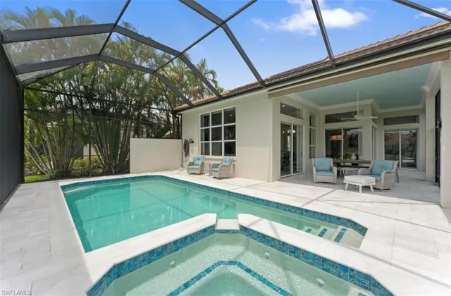 a view of a house with backyard sitting area and garden