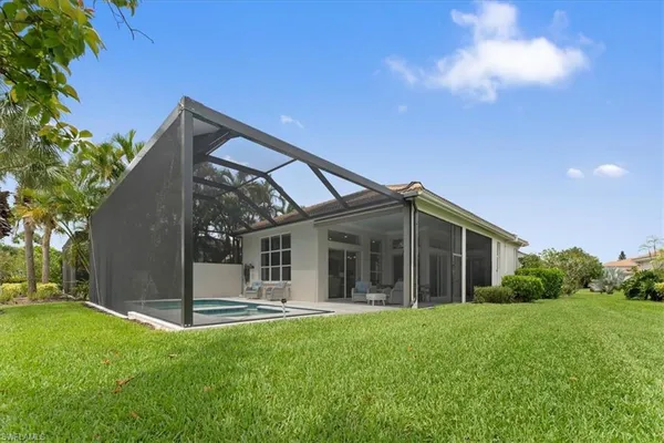 a view of a house with backyard porch and garden