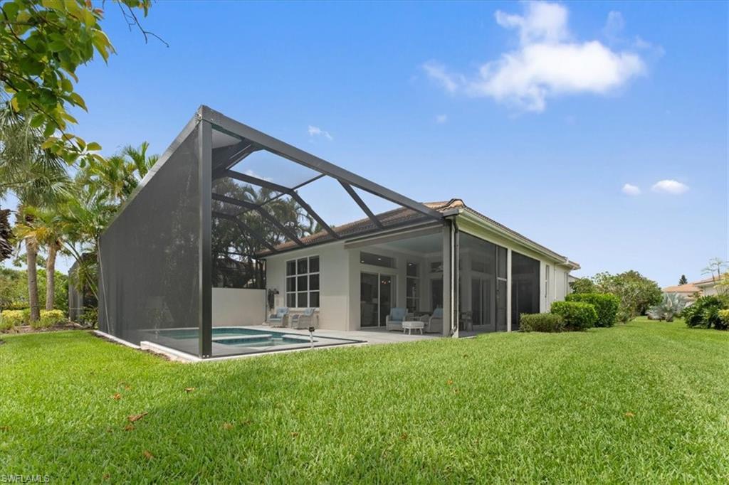 8541 Peppertree Way Naples, FL 34114 - Photo 18 of 41 a view of a house with backyard porch and garden