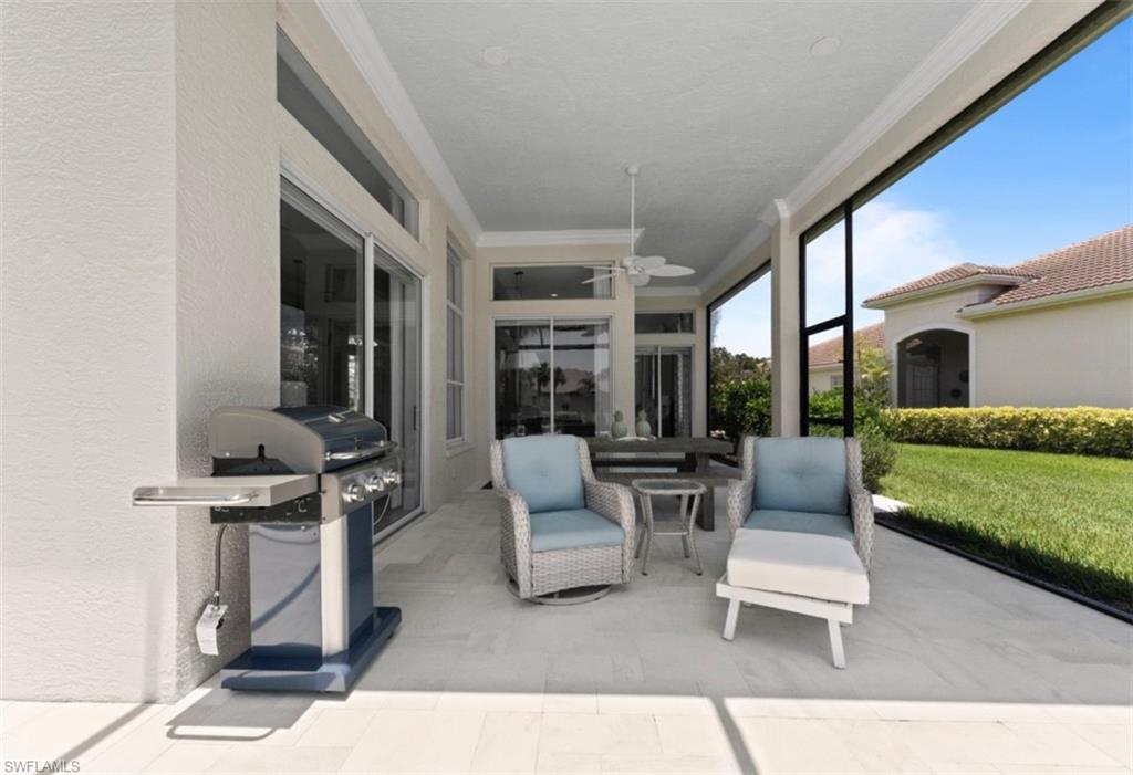 8541 Peppertree Way Naples, FL 34114 - Photo 20 of 41 a building outdoor space with patio furniture and potted plants