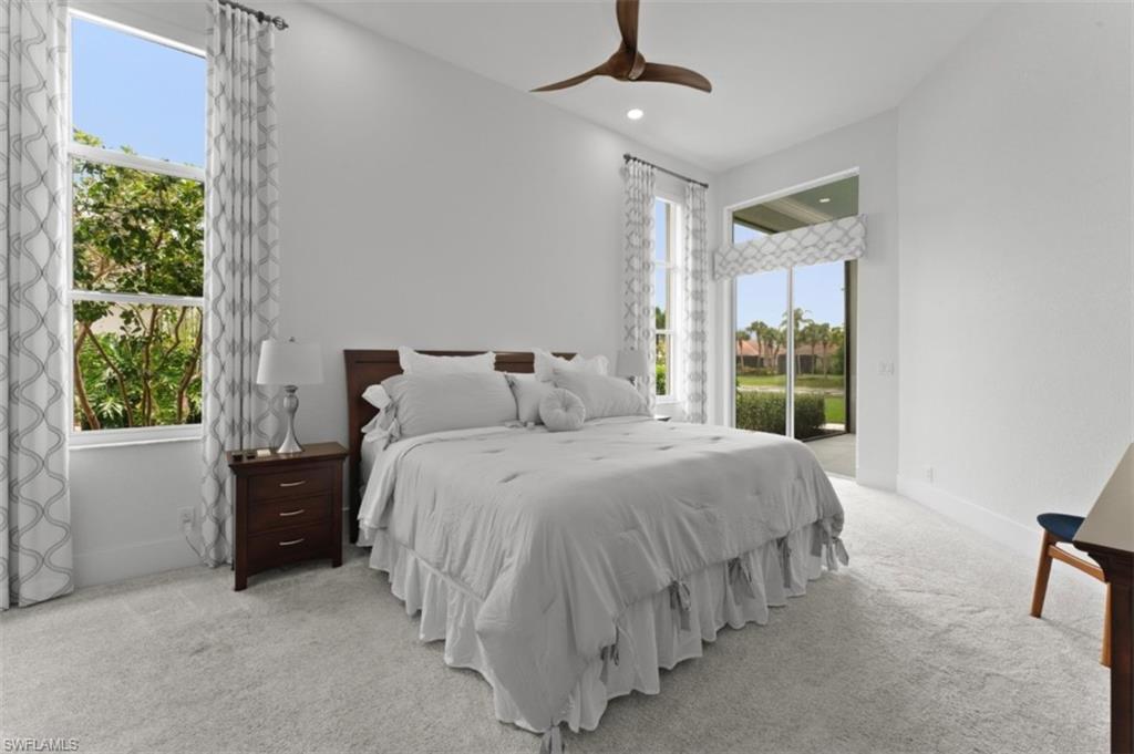 8541 Peppertree Way Naples, FL 34114 - Photo 22 of 41 a bedroom with a bed and a window