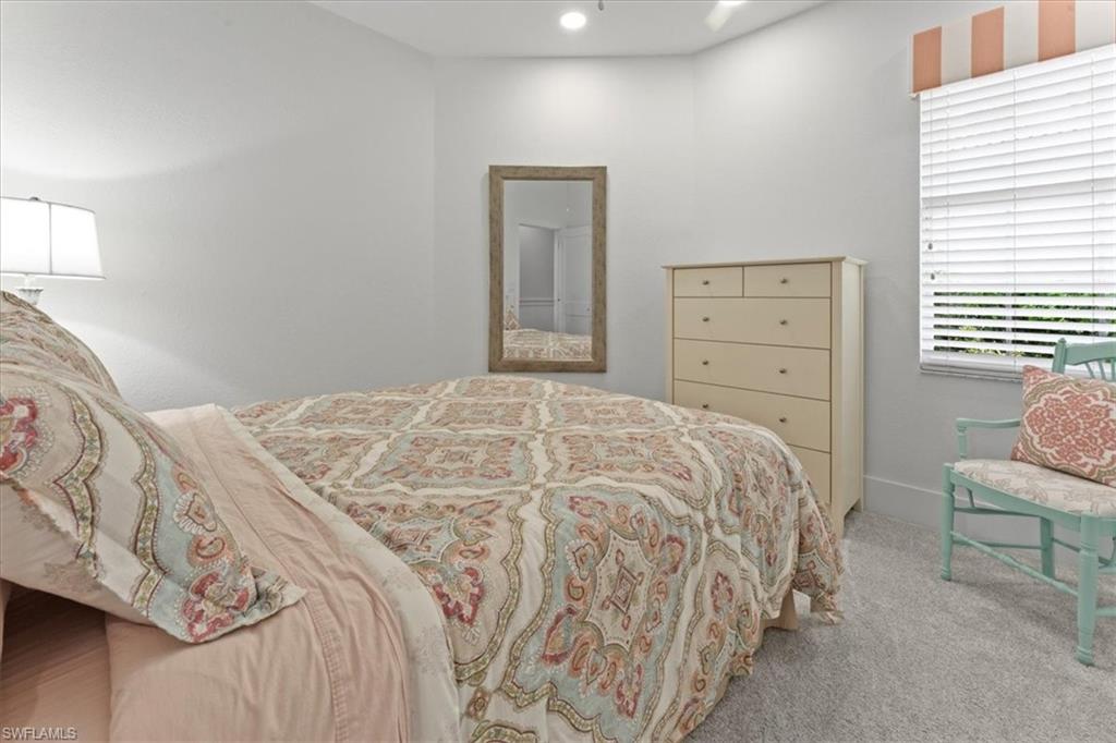 8541 Peppertree Way Naples, FL 34114 - Photo 30 of 41 a bedroom with a bed and a window