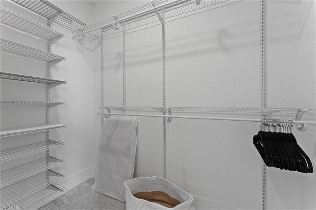 8541 Peppertree Way Naples, FL 34114 - Photo 31 of 41 a bathroom with a shower and toilet