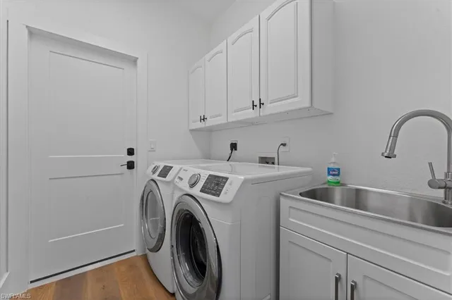 a view of storage and utility room with washer and dryer