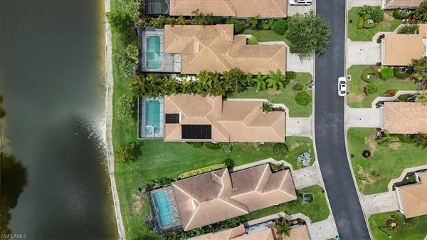 an aerial view of a house with outdoor space