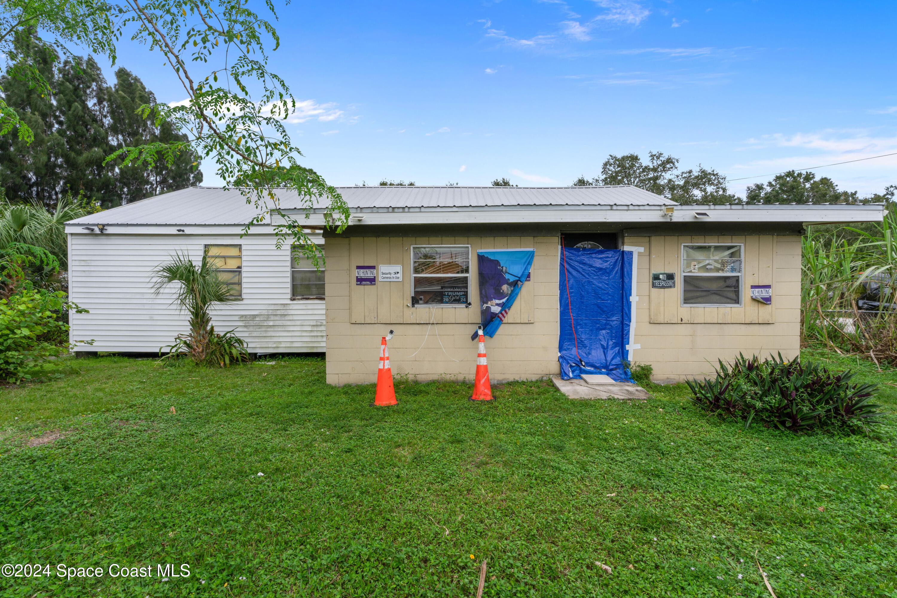 4260 Aurora Road Melbourne, FL 32934 - Photo 1 of 22 a view of a backyard with a garden and plants
