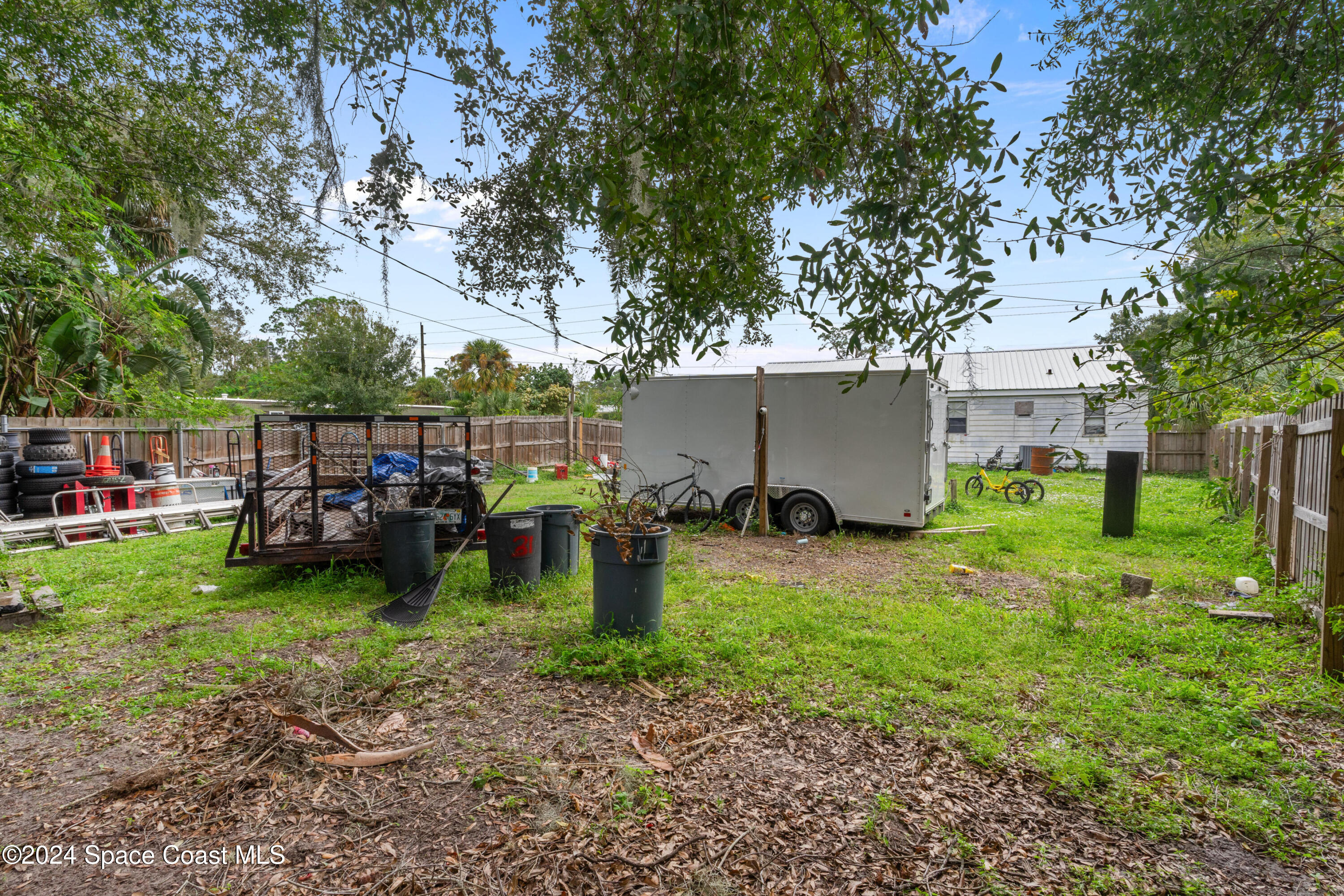 4260 Aurora Road Melbourne, FL 32934 - Photo 6 of 22 a view of a house with yard and sitting area