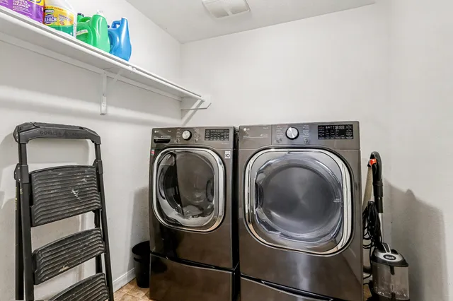 a utility room with dryer and washer