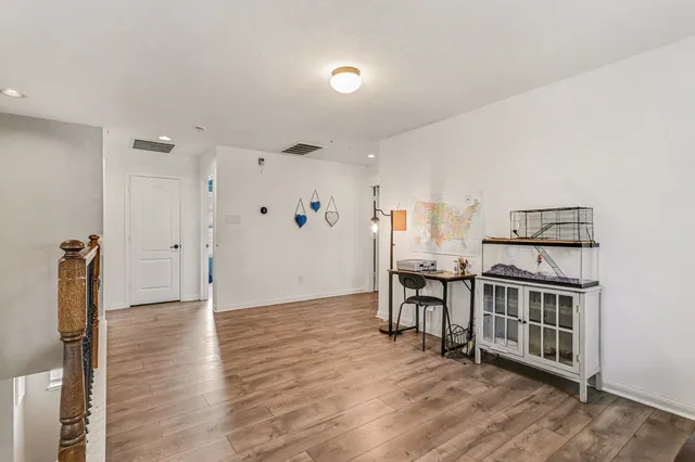 a view of livingroom with furniture and wooden floor