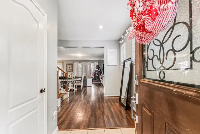 wooden floor with a table and chairs