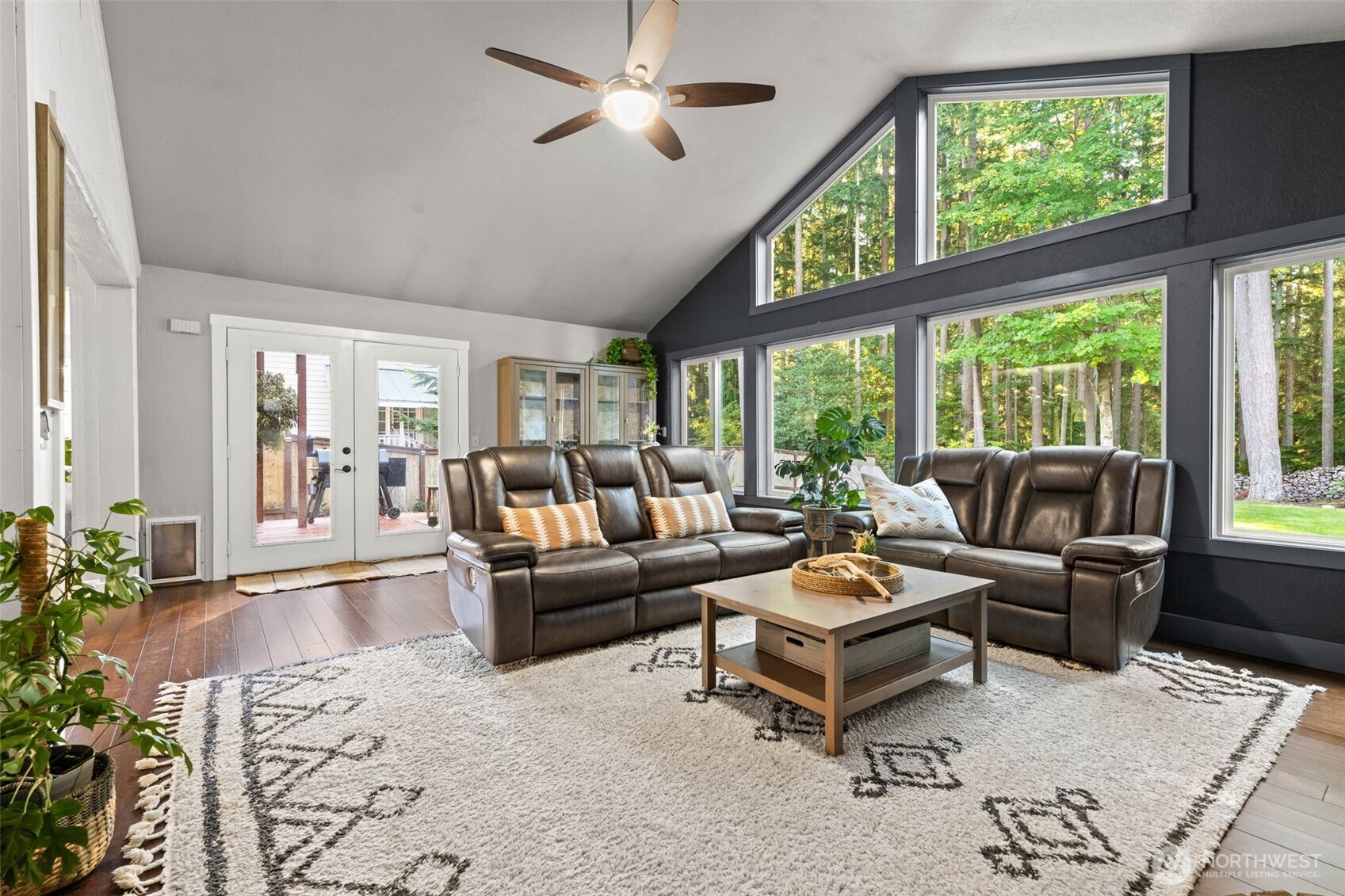 9630 50th Place West Mukilteo, WA 98275 - Photo 13 of 39 a living room with furniture ceiling fan and a large window