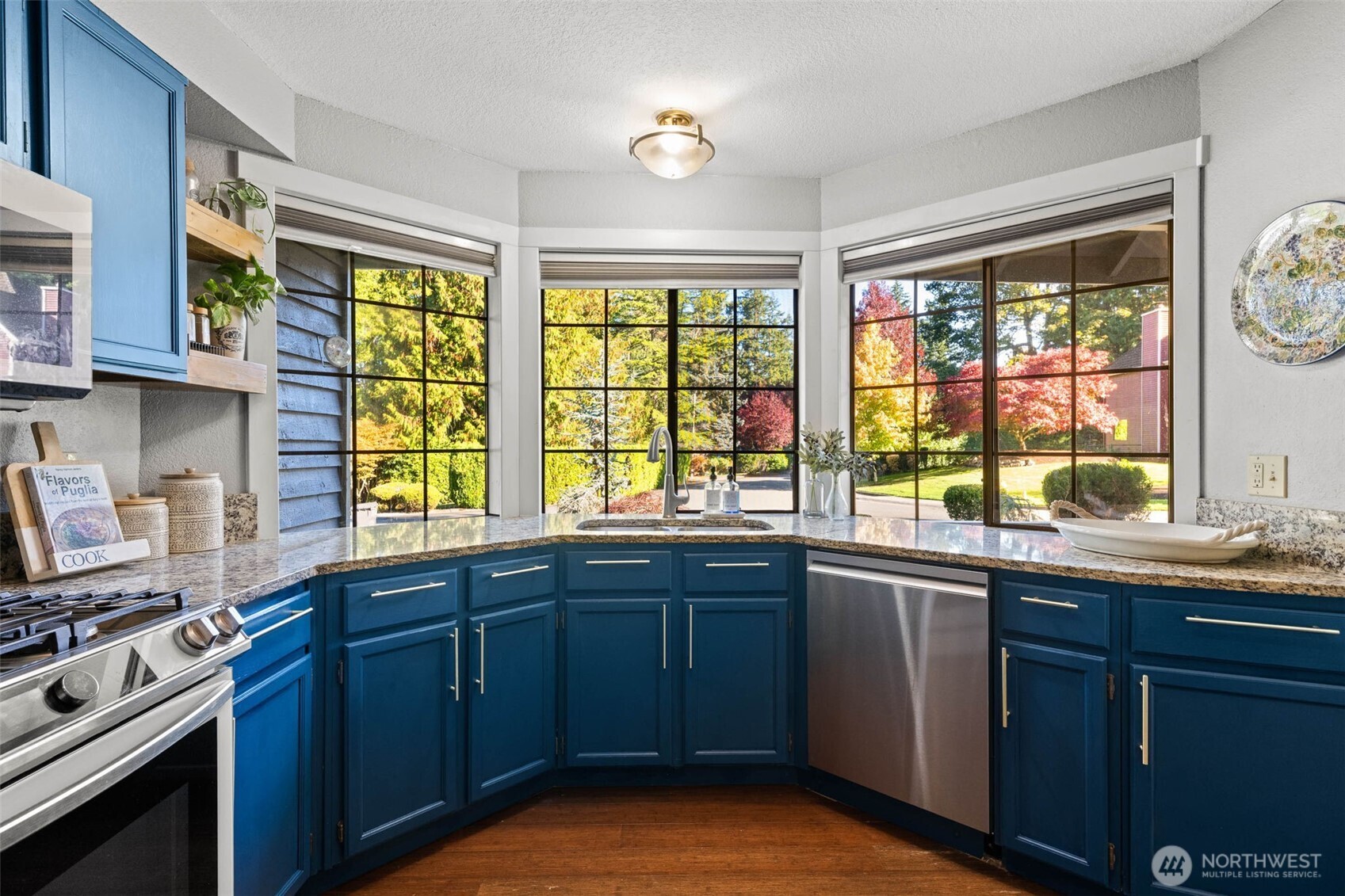 9630 50th Place West Mukilteo, WA 98275 - Photo 20 of 39 a kitchen with a sink stove and cabinets